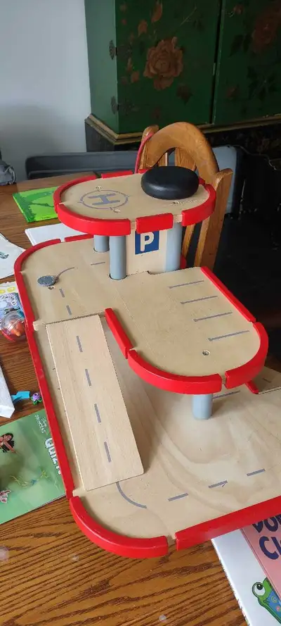 This sturdy wooden toy parking garage is a pre-loved playset that offers endless imaginative fun for...
