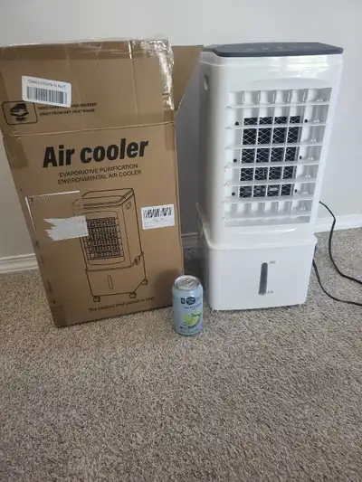 Keep cool this summer with this evaporative air cooler, perfect for personal use, featuring adjustab...