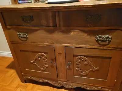 Antique wood hutch in excellent condition. The mirror was replaced. Size is 48 in wide x 22 in deep...