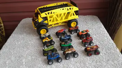 MONSTER TRUCK HAULER WITH 12 MONSTER TRUCKS $85 FOR ALL NO SEPERATION OF PIECES GOOD, CLEAN CONDITIO...