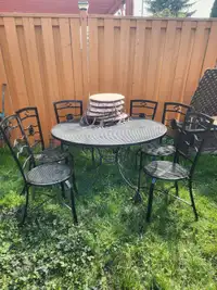 Metal patio set with cushions, 6 chairs one table 