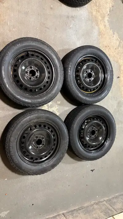 4 winter tires Cooper 215 60/R16, came off a 2007 Ford Focus, mounted on black steel rims with 5 nut...