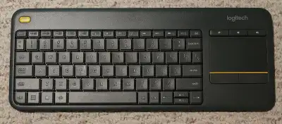For sale is a used Logitech K400+ Wireless USB keyboard/trackpad with USB dongle. Everything works w...