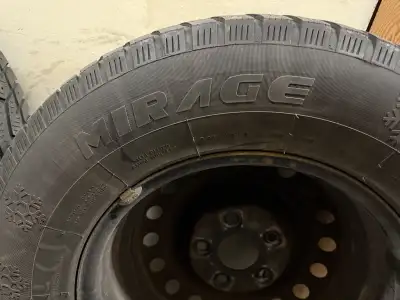 Set of 4 winter tires on steel rims with 5x127 bolt pattern. Plenty of tread left