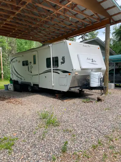 2007 Arctic Fox pull trailer, 27’ propane stove, microwave, refrigerator-freezer, entertainment cent...