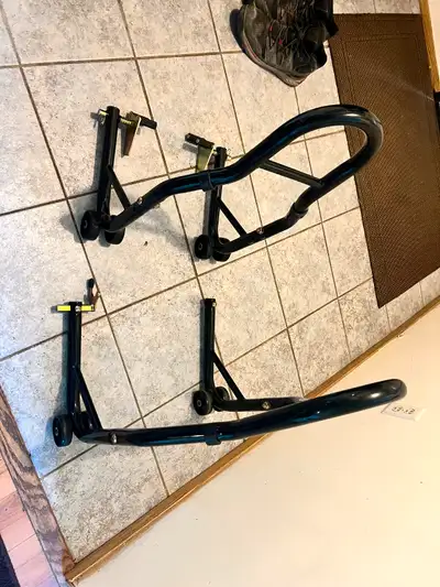 I got set of like new bike stands, front and rear, fits most bikes, 850 lbs rating, work well. Just...