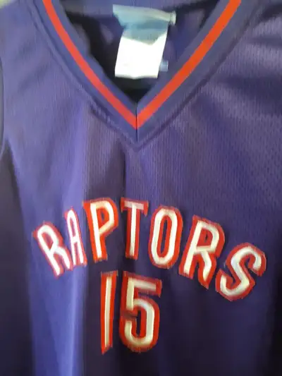 Selling two vintage collectible Toronto Raptors NBA basketball team purple jerseys made by Reebok th...