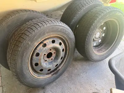Four winter Tires and 4 rims from a 2014 Dodge Carvan. Good tread on winters. Selling my van separat...