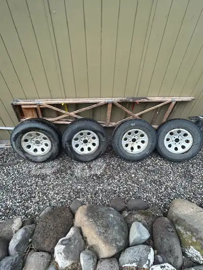 Set of 4 studded 265/70P 17 used 3 peak winter tires mounted on 6 lug GM rims. Est tires 50-60% left...