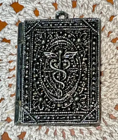 Unique 1940’s Medical (Caduceus) Filigree Book Locket Pendant. Made with beautiful filagree. There's...