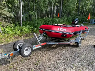 Selling near mint Zodiac style boat package. Includes: Zebec Zodiac boat with wood floor holds 4 . B...