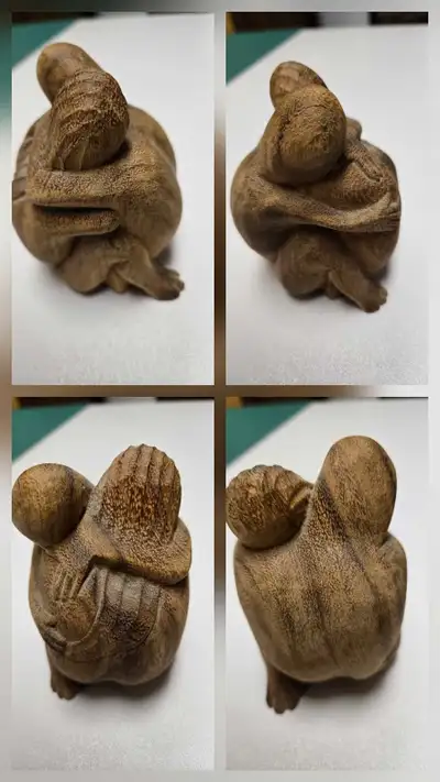 Carved wooden Hugging Man & Woman sculpture. Indonesian wood. 4 inches high. Must be picked up in Cr...