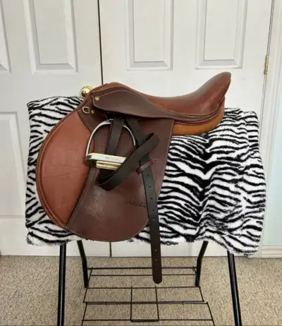 All-purpose English saddle 17” seat Med-wide tree Wool flocked Comes with stirrup irons and leathers...