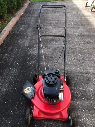 This is a Craftsman lawn mower, perfect for keeping your lawn looking trim and tidy! It's ready to t...