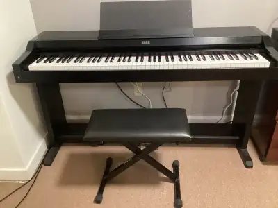 PIANO ÉLECTRONIQUE DE MARQUE KORG CONCERT 3500 avec BASE et BANC, View more