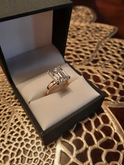 Stunning best quality and color moissanite diamond engagement ring. 5carats emerald cut, flawless co...
