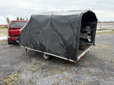 Triton Double Snowmobile Trailer. 123” Long and 102” wide. Trailer Tilts to load/unload Back flap ha...