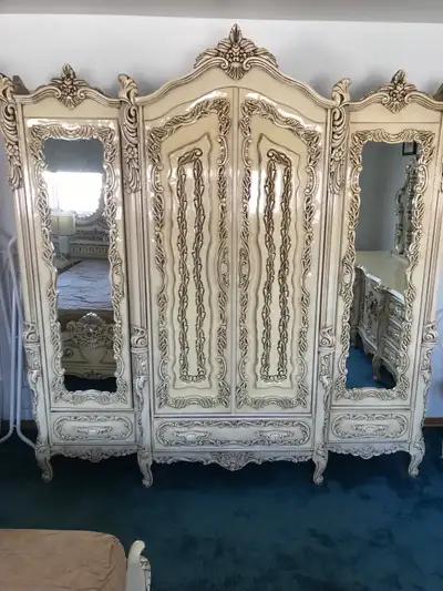 This antique-style armoire offers ample storage with a touch of elegance. Perfect for adding a vinta...