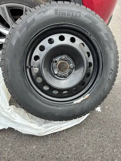 225/60/R17 winter tires on rims (Pirelli), 4 tires. Steel rim 5 bolt pattern Used- Ford escape Comes...