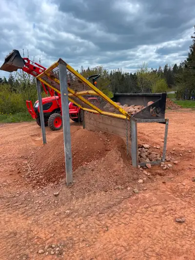Screener not needed anymore asking $2500, 6ft high X 8ft wide. Skid steer Rock bucket and stand $120...