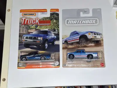 - 1995 Nissan Hardbody D21 - Matchbox Truck Series lot of 2 variations - 1/64 scale diecast trucks w...