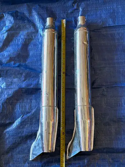 Motorcycle exhaust pipes, fish fin style. These came off of an older Harley, but they should fit jus...