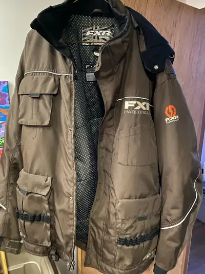 Get ready to hit the slopes with this FXR Hardwear brown winter jacket, designed for ultimate warmth...