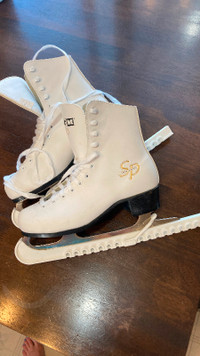 Size 7 figure skates, worn twice!