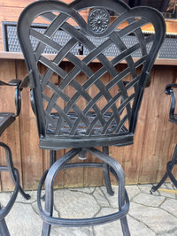  Cast-iron swivel bar stool outside