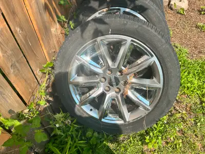 4 tires on rims for a GMC pickup truck mounted on chrome rims with minimal damage and good treads. T...