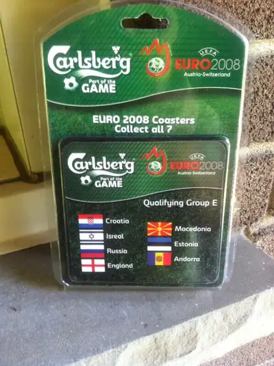 This is a new in the package Euro Cup 2008 / Carlsberg wooden coaster representing the 7 teams in Gr...