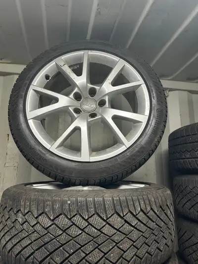 18” OEM Audi A4/S4 wheels with 225-45-18 continental Viking contact 7 winter tires. In very good con...