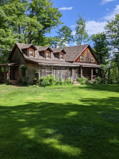 An enchanting restored log home on 5.5 acres of waterfront property and just 10 minutes outside of P...
