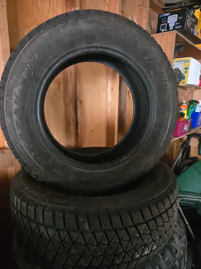 Tires might have 5000km on them. Both 11/32 tread. Asking $100 for both. Came off Grand Caravan. Loc...