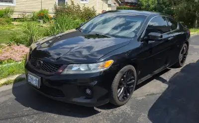 This sleek black Honda Accord Coupe is a reliable companion with 273,000 km on the odometer and come...