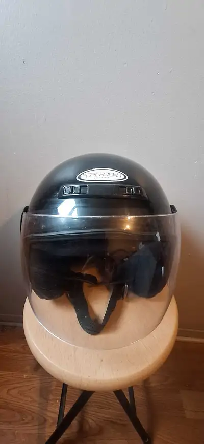 THH motorcycle helmet with face shield and air vents. Size is XL.