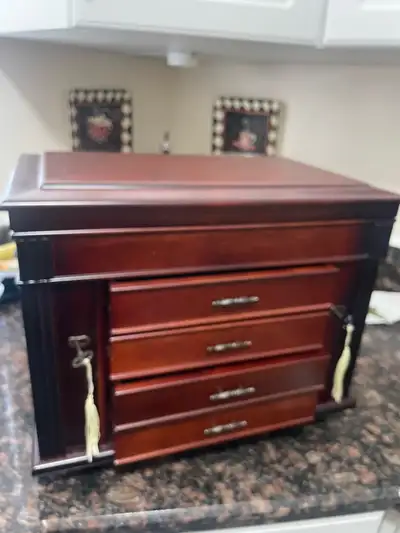 Solid wood jewelry box with drawers, locking sides with key.