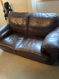 Brown leather love seat 