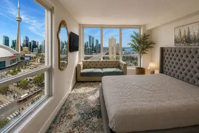 Live where others dream of visiting. Wake up and fall asleep to breathtaking skyline views of Toront...