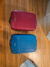 2 Delsey suitcases - hard sided carry on roller bags