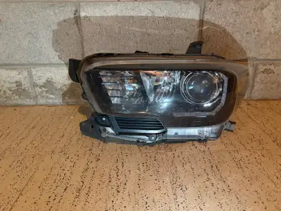 Genuine Toyota driver's side headlight from a 2018 Tacoma TRD Pro Used, worked when removed Price as...