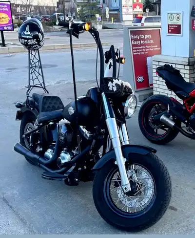 Only 7000 Km on a 103ci 2017 Harley Davidson Softail Slim Black Bassani pipes Custom sissy bar Ape h...