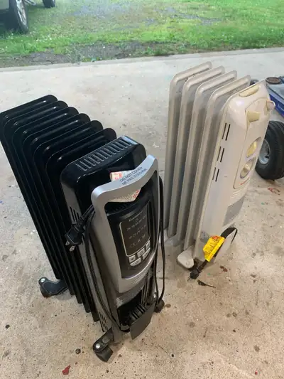 2 good working oil heaters white one is honeywell , black one is garrison . 35.00 es or both for 50...