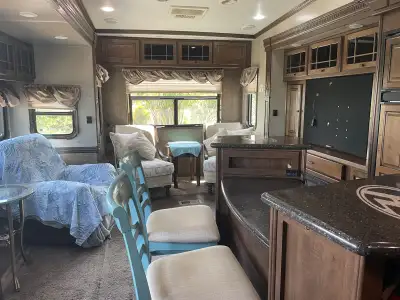 Beautiful well maintained 38ft RV with separate good size bedroom. One full bath. Very rooms with 3...