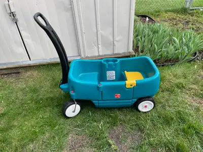 Step 2 brand children's wagon, in excellent condition, with two cup holders, a swing out door, two s...