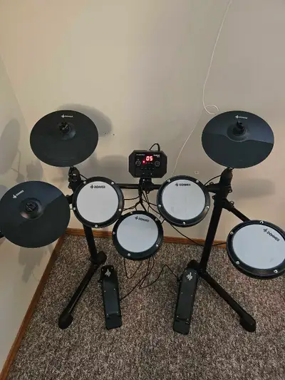 Everything works, comes with a set of drum sticks