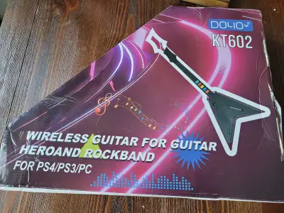 Get ready to rock with this DOYO wireless guitar controller, compatible with PS4, PS3, and PC. This...