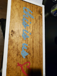 Wooden sign
THIS IS US
