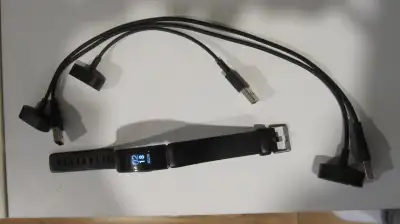 Used Fitbit Inspire HR with 3 charge cables. Slight scratches on face but no cracks. Also includes s...