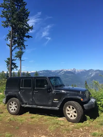 2012 Jeep Wrangler Sahara Unlimited with Dual Top Open to Reasonable Offers - Original owner. - Kept...